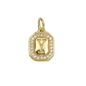 Macro detail of 18k gold plated letter Y pendant with sparkling cubic zirconia settings