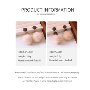 Detail showing wood and beige furball drop earrings with product size and weight specs