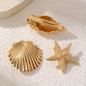 Golden starfish and seashell metal hair clips set for a beach vacation look