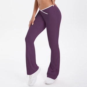 Detailed view of purple yoga flare pants featuring a V-shaped cross high waist with white trim