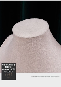 Macro shot of plush velvet jewelry bust showing detailed fabric texture and sponge lining