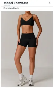 Detail of high-stretch black yoga set featuring V-neck sports bra and high-waist shorts