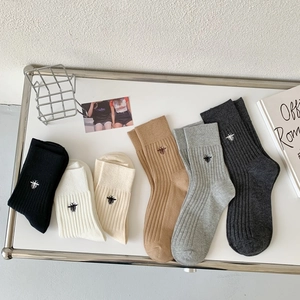 6 pairs of ribbed cotton socks with bee embroidery in black, white, and grey tones