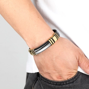 Men's handmade braided black leather bracelet with silver and gold magnetic metal clasp