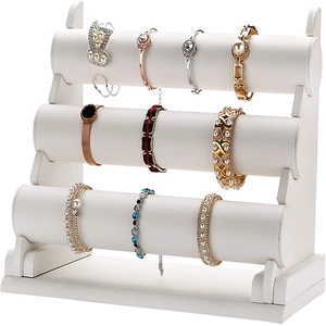 Three-tier white bracelet watch display stand with cylindrical velvet storage bars
