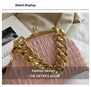 Macro shot of pink pleated leather texture with gold metal frame and chunky chain