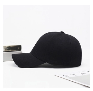 Detailed view of a minimalist black twill baseball cap on a clean white background