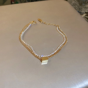 Double-layer gold plated bracelet with zircon pavé and geometric cube pendant for women