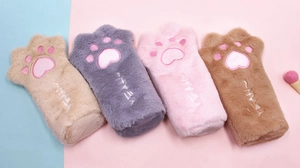 Detailed view of four colorful plush cat paw pencil cases with soft fur and embroidery