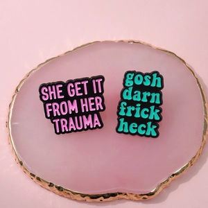 Minimalist enamel pin set featuring funny quotes on pink marble background for clothes
