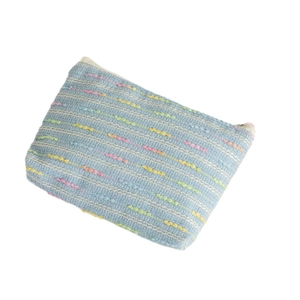 Light blue woven mini coin purse with colorful polka dots and a metal zipper