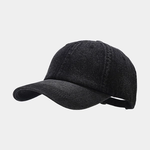 Classic black denim baseball cap with six-panel structure and curved brim on grey background