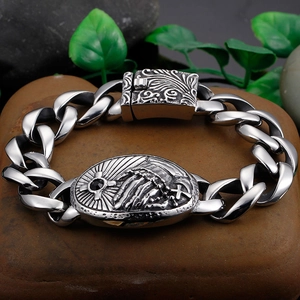 Macro detail of retro cross and praying hands relief on men's titanium steel bracelet