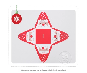 Flat lay of unfolded Christmas S932 gift box with Santa Claus motif and red white design