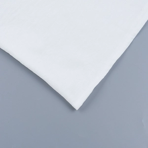 Detail of the white lightweight knitted fabric showing the texture and V-neck ring accent