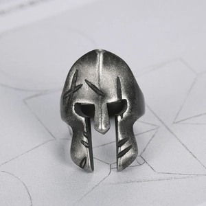 Macro shot of retro Spartan mask ring with distressed silver finish and fine details