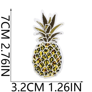 Detailed embroidery patch showing a pineapple with yellow leopard print pattern and size markings