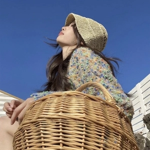 Japanese style foldable straw bucket hat for women with minimalist knit sunshade design