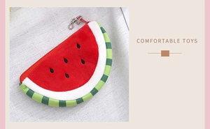 Close-up of watermelon plush coin purse with soft texture and vibrant red embroidery