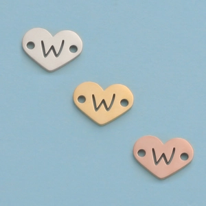 Three heart-shaped 12mm stainless steel charms in silver, gold, and rose gold finishes
