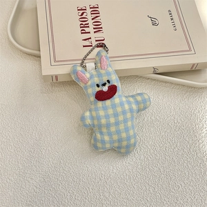 Detail of cute blue and yellow plaid rabbit plush pendant with metal bead chain