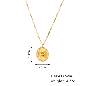Detail view of gold heart oval pendant with sunburst texture and size measurements