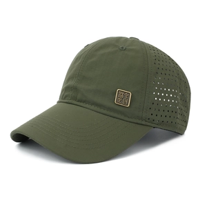 Detail view of military green baseball cap featuring laser-cut vents and metal decorative tag