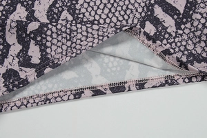 Detail of snake skin pattern stitching and double-needle lockstitch on yoga pants