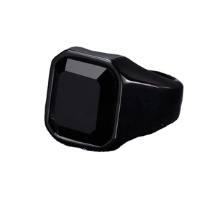Adjustable men's black copper ring with square step-cut black gemstone on white background