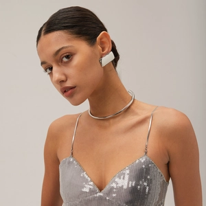 Minimalist silver rectangle earrings and metal collar necklace on a fashion model