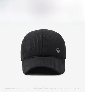 Front view of black striped winter baseball cap with ear protection and metal logo detail