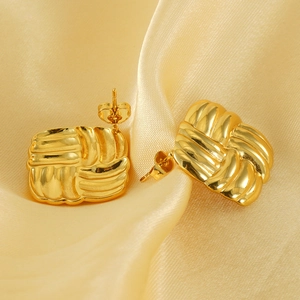Textured 18k gold plated square stud earrings on elegant silk fabric background