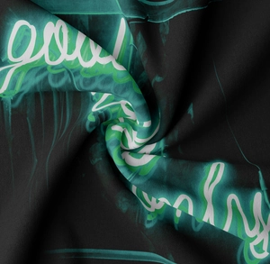 Close-up of soft polyester fabric with glowing neon good vibes only print design