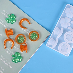 Silicone mold kit for DIY resin jewelry featuring clover and hat shaped epoxy pendants