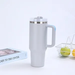 Detail of a 40oz stainless steel vacuum insulated travel tumbler with handle and straw
