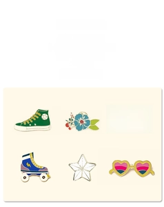 Close-up of colorful enamel pins set including rainbow, sneaker and heart designs
