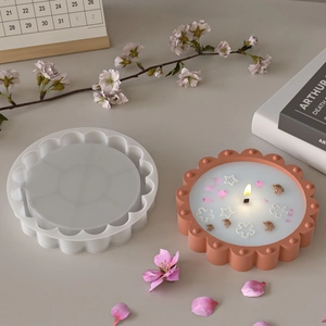 Detail of DIY lace bead tray silicone mold with finished floral scented candle cup