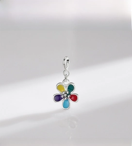 Macro shot of colorful S925 sterling silver flower pendant with enamel petals