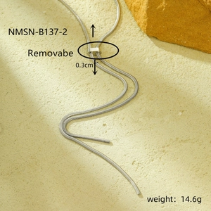 Detailed macro view of silver snake bone chain with sliding adjustable clasp and stone decor