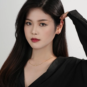 Model wearing S925 sterling silver hoop earrings with rainbow cubic zirconia stones