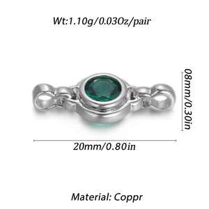 Macro detail of a 20mm copper jewelry connector with a round green zircon in silver finish