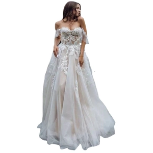 Elegant strapless ivory wedding dress with lace floral embroidery and layered tulle skirt