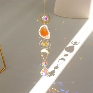 Macro view of crystal prism on agate suncatcher casting vibrant rainbow patterns