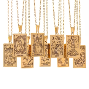 Detailed grid of nine vintage gold tarot card pendants featuring classic arcane symbols
