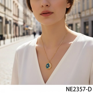 Close-up of star and moon pendant necklace with blue pavé zircons on model neck