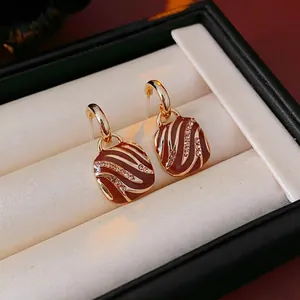 Retro square zebra striped earrings with gold trim and crystal accents in gift box