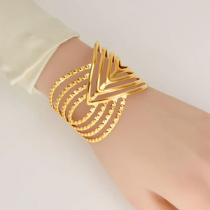 Chic 304 stainless steel wide gold cuff bracelet featuring layered geometric V-shaped lines