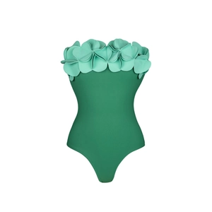 Detail of 3D mint green flower petal appliques on a navy blue one-piece swimsuit