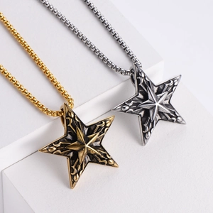 Detail of retro punk pentagram necklaces in gold and silver over geometric stone blocks