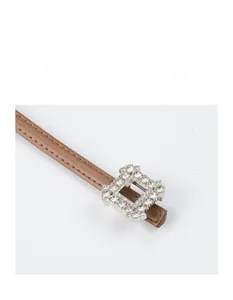 Detail of thin brown leather belt featuring a crystal-encrusted square alloy buckle